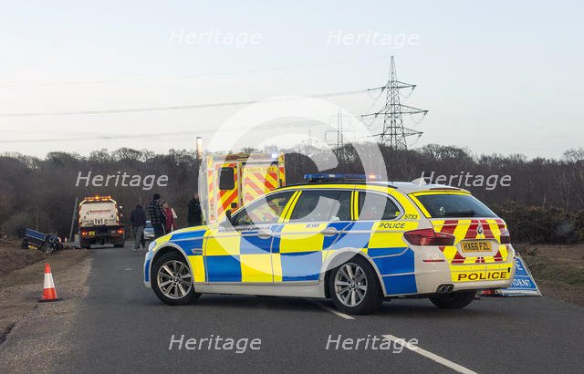 Police car and ambulance attending road traffic accident 2018. Creator: Unknown.