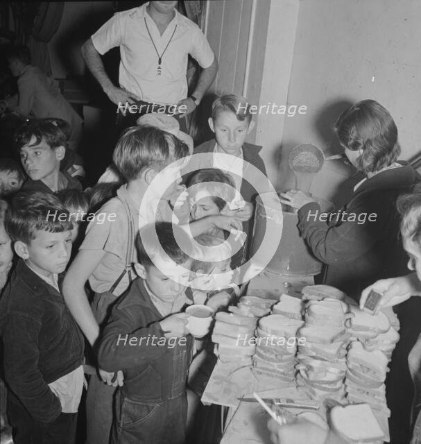 The children at Halloween party in Shafter migrant cooperative, California, 1938. Creator: Dorothea Lange.
