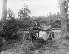A woman riding a Douglas flat-twin motorcycle with a sidecar, 1900-1910. Artist: Unknown.