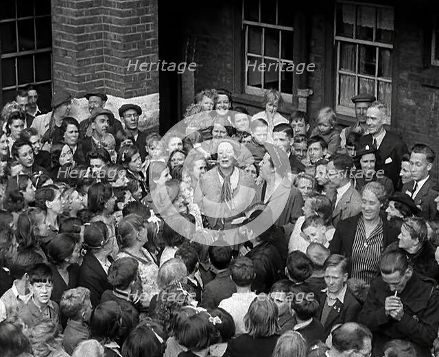 Elsie and Doris Waters Calling on People to Save for War Bonds, 1942. Creator: British Pathe Ltd.