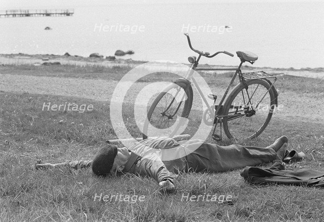 A nap by the sea at Borstahusen, Landskrona, Sweden, 1967. Artist: Unknown