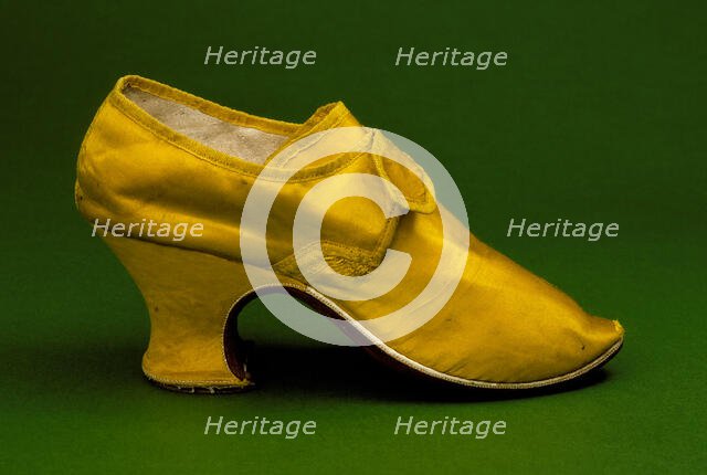 Woman's yellow silk shoe with "louis heel", England, between c.1760 and c.1765. Creator: Unknown.