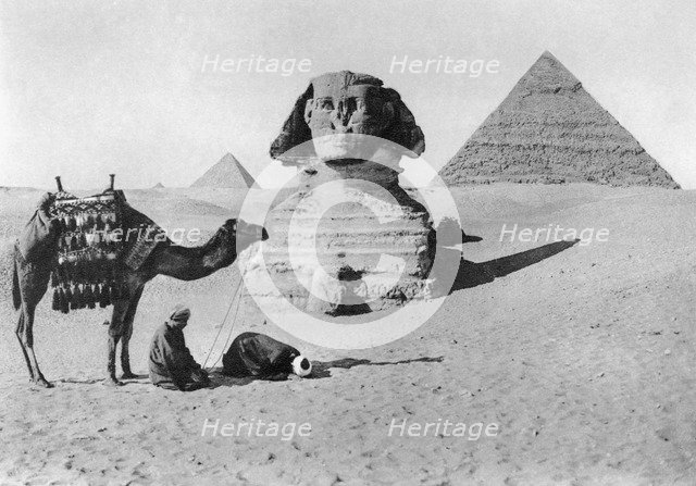 Praying before a sphinx, Cairo, Egypt, c1920s. Artist: Unknown