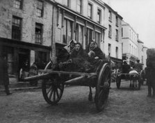 Killarney - 3 Irish women going to a funeral in a horse-drawn cart, (1899?). Creator: Frances Benjamin Johnston.