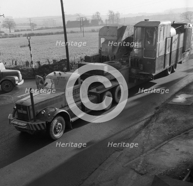 Early 1940s Diamond T truck pulling a large load, South Yorkshire, 1962. Artist: Michael Walters