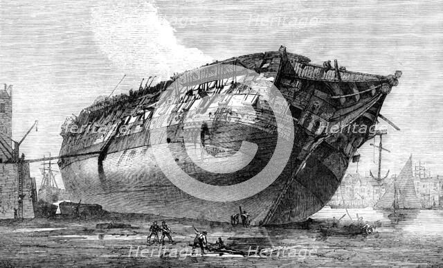Breaking-up H.M.S. Queen at Rotherhithe, 1871. Creator: Unknown.