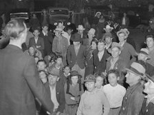 Night street meeting of cotton strikers near end of defeated strike. Kern County, California, 1939. Creator: Dorothea Lange.