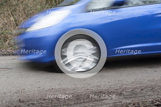 Pot holes in road surface 2017. Creator: Unknown.