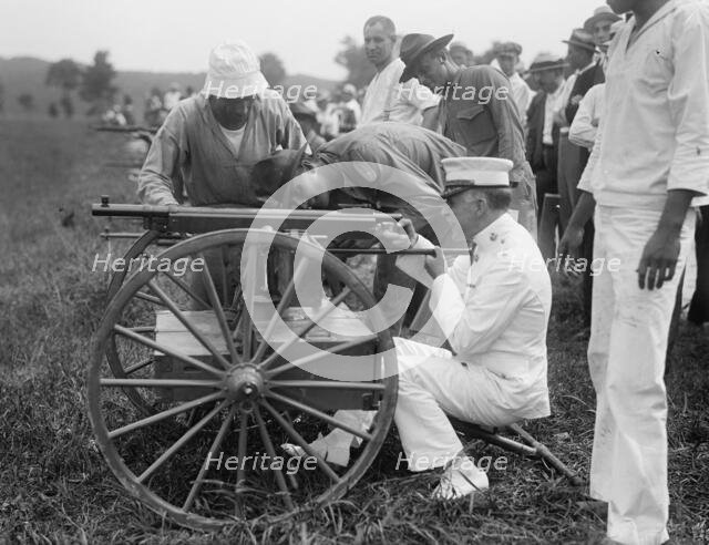 Marine Corps Rifle Range, Winthrop, Md. - Gen. Barnett Testing Colt's Automatic Machine Gun, 1917. Creator: Harris & Ewing.