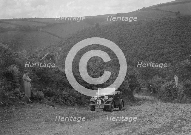 Austin 10 competing in the Mid Surrey AC Barnstaple Trial, Beggars Roost, Devon, 1934. Artist: Bill Brunell.