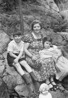 Javits, Benjamin, Mrs., and children, seated oudoors, ca. 1935. Creator: Arnold Genthe.