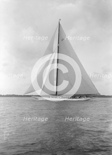 The 23-metre cutter 'Astra' sailing close-hauled. Creator: Kirk & Sons of Cowes.
