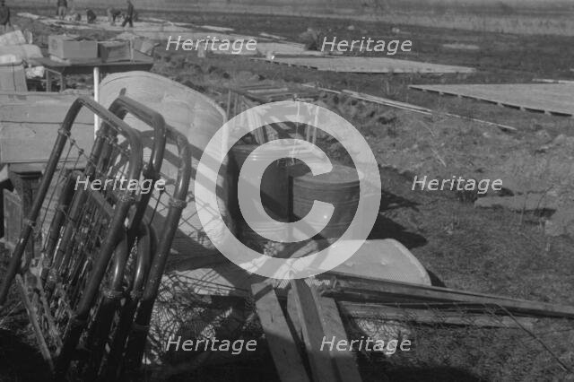 Possibly: Setting up a tent in the camp for white flood refugees, Forrest City, Arkansas, 1937. Creator: Walker Evans.