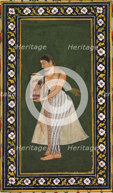 Nur Jahan, holding a portrait of Emperor Jahangir, c. 1627. Creator: Bishandas (Indian).