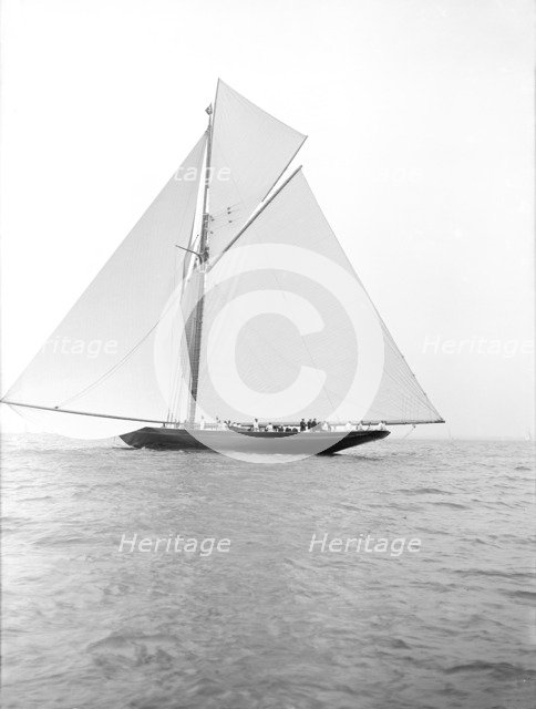 The 221 ton gaff-rigged cutter 'Britannia' sailing under spinnaker, 1913. Creator: Kirk & Sons of Cowes.