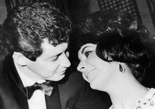 Eddie Fisher and his wife, Elizabeth Taylor, at a party in Rome, 1961. Artist: Unknown
