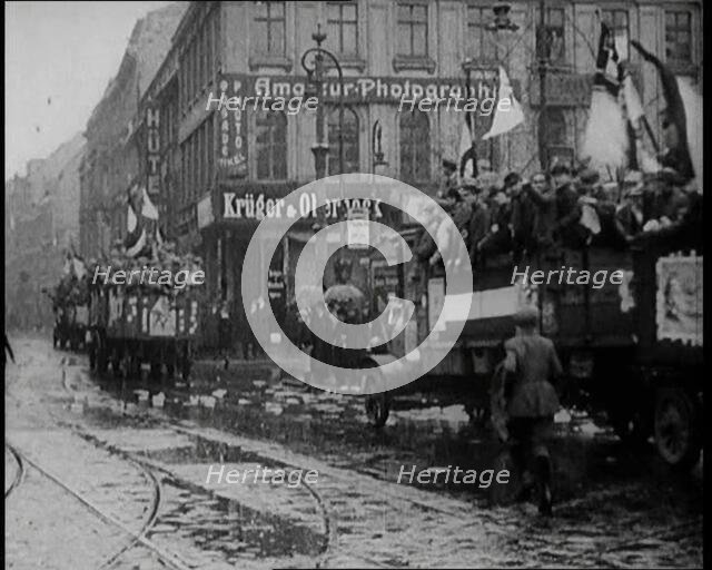 National Socialist (Nazi) Party Campaigning in Germany Scattering Pamphlets from  Trucks..., 1926. Creator: British Pathe Ltd.