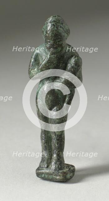 Figurine of a Standing Naked Man Holding a Baby, Ptolemaic Period-early Roman Period 200 BCE-100 CE. Creator: Unknown.