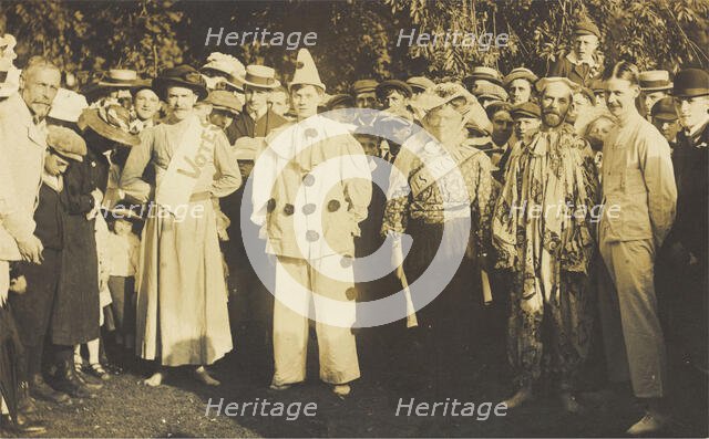 People at Rickmansworth, Herts, some in drag, gather outside at a swimmming gala, 1908. Creator: Unknown.