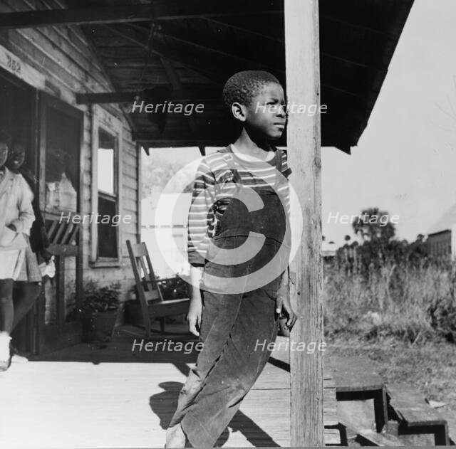 Young boy on his front porch, Daytona Beach, Florida, 1943. Creator: Gordon Parks.