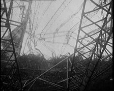 The Burnt Remains of the R-101 Airship Lying on the Ground After Fire and Destruction, 1930. Creator: British Pathe Ltd.