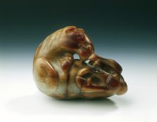 Jade horse with knotted tail biting its rear foot, Tang dynasty, China, 618-907. Artist: Unknown