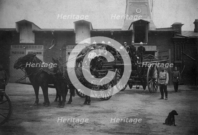 Horse-Drawn Departure of a Fire Ladder, early 20th century. Creator: Unknown.