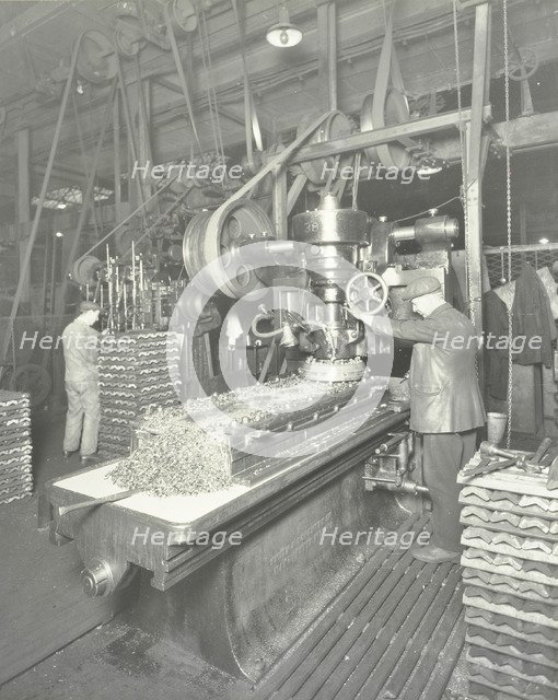 Man using a miller and planer, Charlton Central Repair Depot, London, 1932. Artist: Unknown.