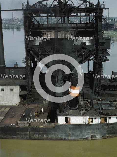 Loading coal into a lake freighter at the Pennsylvania Railroad docks, Sandusky, Ohio, 1943. Creator: Jack Delano.