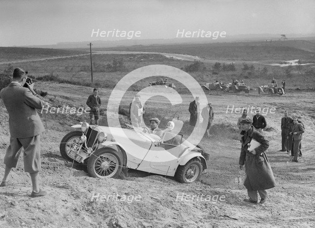 MG TA of the Cream Cracker Team competing in the Great Weat Motor Club Trial, 1938. Artist: Bill Brunell.