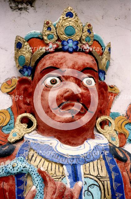 Painted relief of a deity, monastery, Ladakh, India, 1988. Creator: Amanda Waite.