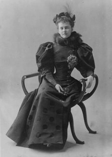 Mrs. Elizabeth Cameron, full-length portrait, seated, facing front, between c1890 and c1910. Creator: Frances Benjamin Johnston.