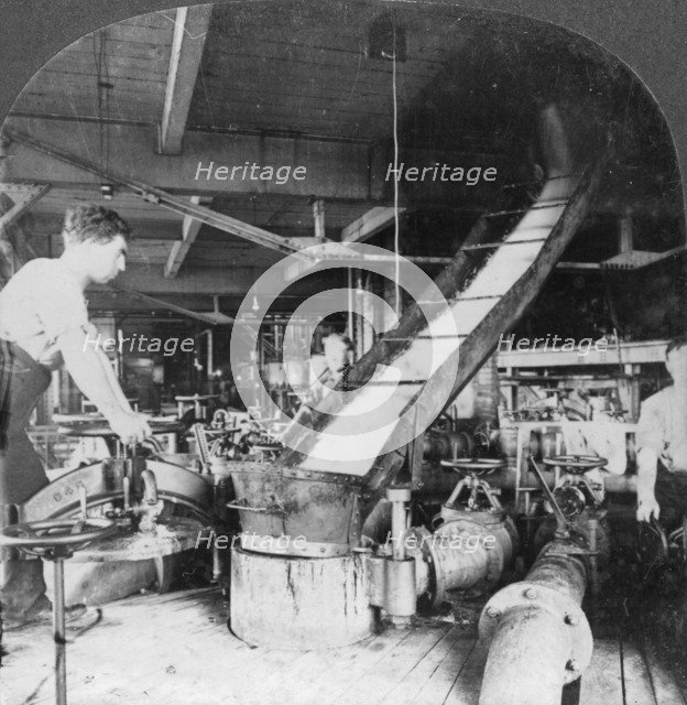 Sugar beet pulp and juice flowing from tank to tank, Montreal, Canada, early 20th century(?). Artist: Keystone View Company