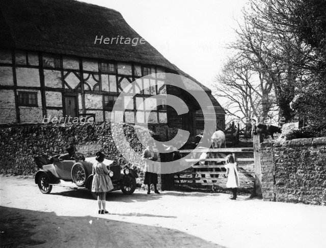 Calcott 2-seater car parked outside a farm gate, c1921-c1922. Artist: Unknown