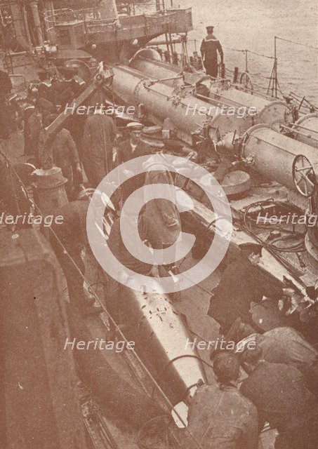 Cleaning and adjusting torpedoes, c1917 (1919). Artist: Unknown.