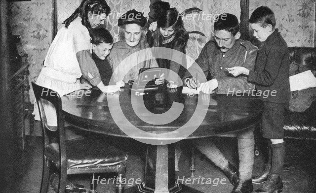 Children emptying their money boxes to invest in war bonds, 1936. Artist: Unknown
