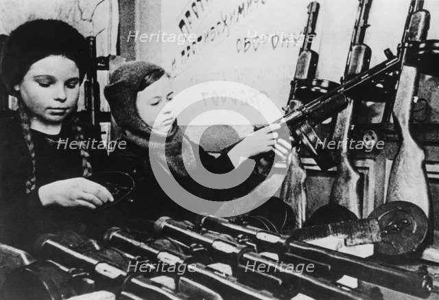 Young girls assembling machine guns in a Russian factory, 1943. Artist: Unknown