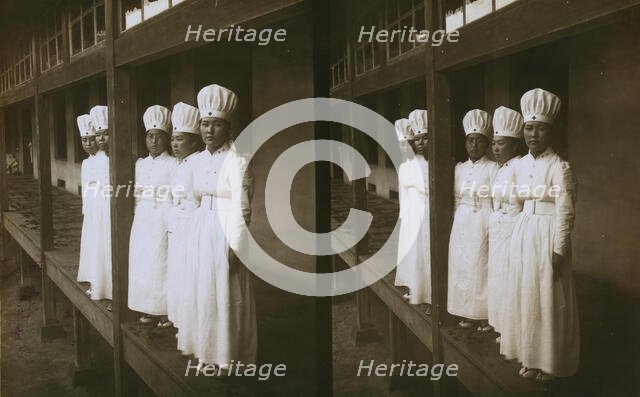 Japanese nurses attending to wounded soldiers in a hospital ward, c1905. Creator: Underwood & Underwood.