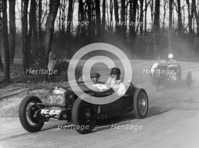 Riley leading a Fraser-Nash through Coppice Corner, Donington Park, Leicestershire, (c1930s?). Artist: Unknown