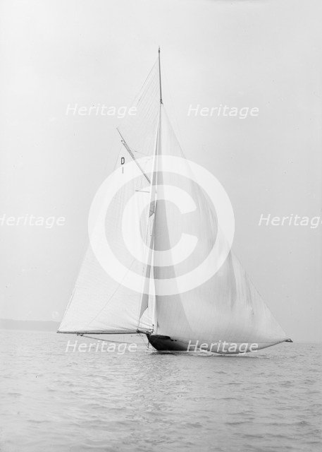 The 15 Metre sailing yacht 'Pamela' searching for wind, 1913. Creator: Kirk & Sons of Cowes.
