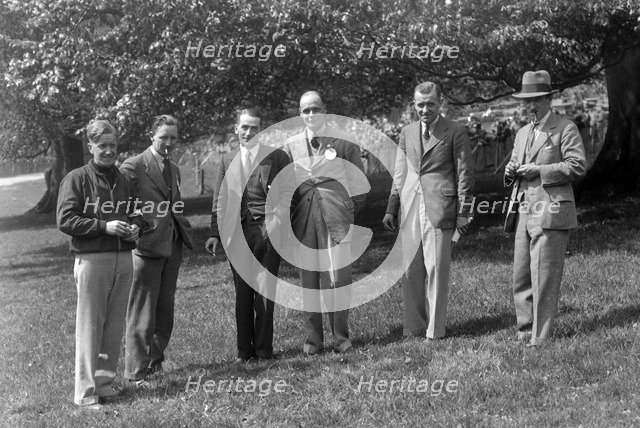 Group of men at Donington Park motor racing circuit, Leicestershire, c1930s. Artist: Bill Brunell.