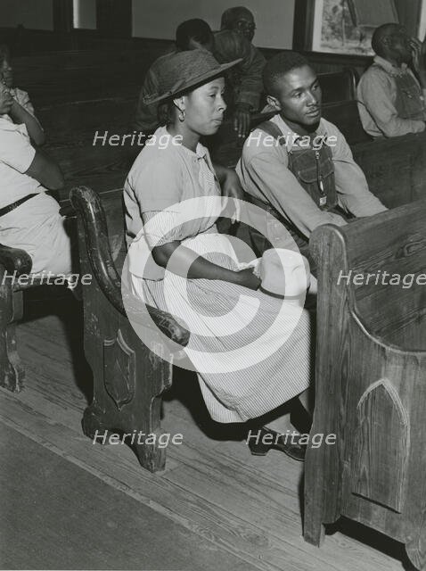 African Americans sitting in pews at a meeting of Farm Security Administration borrowers..., 1941. Creators: Farm Security Administration, Jack Delano.