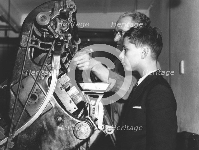 David Reiss inspects a linotype machine at the Jewish Chronicle, London, 1960. Artist: EH Emanuel