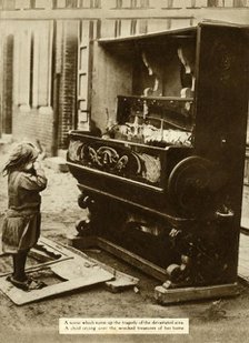 Child with damaged piano after an air raid made her homeless, First World War, 1918, (1935). Creator: Unknown.