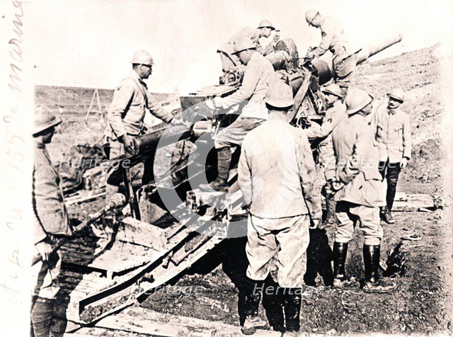 Loading shell into 155 mm gun, c1914-c1918. Artist: Unknown.