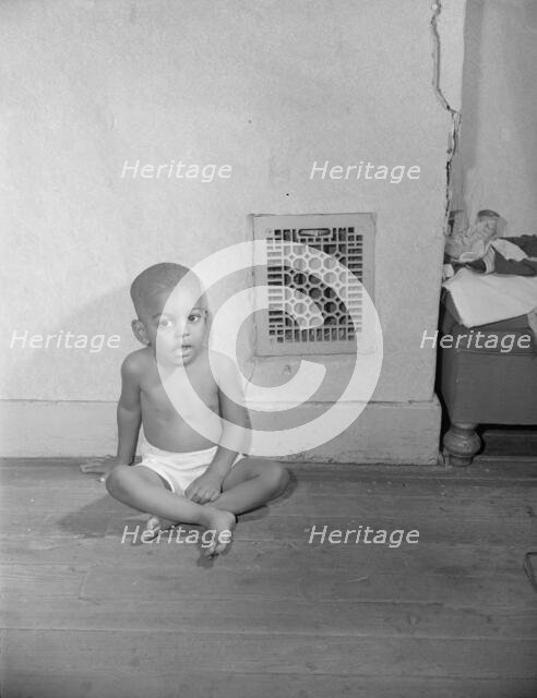 Grandson of Mrs. Ella Watson, a government charwoman, Washington, D.C., 1942. Creator: Gordon Parks.