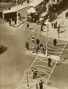 Traffic and pedestrians in Trafalgar Square, London, 1935.  Creator: Unknown.