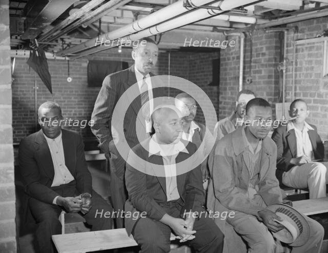 Air raid wardens' meeting in zone nine, Southwest area, Washington, D.C, 1942. Creator: Gordon Parks.