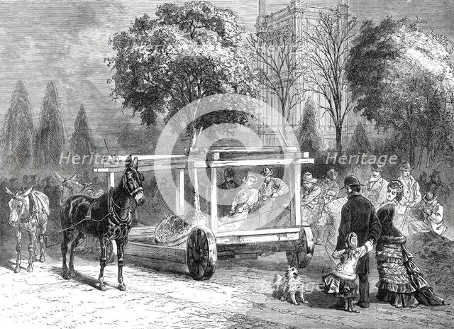 The American Centennial Exhibition at Philadelphia: transplanting trees in the grounds, 1876. Creator: Unknown.