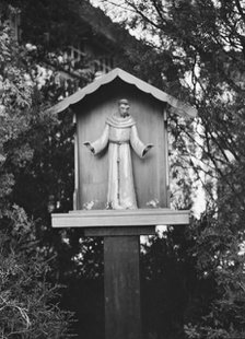 St. Francis statue in garden of Mrs. J.C. Brady, 1931 July 14. Creator: Arnold Genthe.